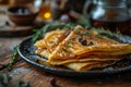 A thin pancakes on plate on wooden background. Maslenitsa