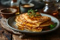 A thin pancakes on plate on wooden background. Maslenitsa