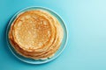 Thin pancakes or russian blini on blue background. Generative AI Royalty Free Stock Photo