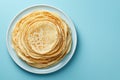 Thin pancakes or russian blini on blue background. Generative AI