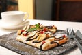 Thin pancakes served with sauce and berries on slate plate Royalty Free Stock Photo