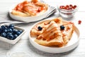 Thin pancakes served with syrup and berries Royalty Free Stock Photo