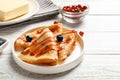 Thin pancakes served with syrup and berries Royalty Free Stock Photo