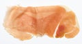 Thin piece of jamon on a white background, top view