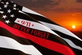 Thin red line firefighter flag on susnet sky background. Remembering, memories on fallen firefighters officers.