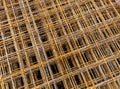 Thin rusty steel welded wire mesh for concrete reinforcing. Industrial material corrosion background. Royalty Free Stock Photo