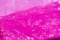 Thin sheet of pink colour cellophane with shiny crumpled surface texture on white background, Abstract, Light & Shadow concept, Royalty Free Stock Photo