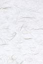 Thin silk fibers decorated paper background. Decorative yunlong kam paper texture. Portrait vertical orientation