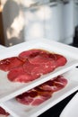 Thin slice meat for Korean Barbecue on a white plate