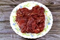 Thin slices of beef pastrami, made from beef brisket, raw meat is brined, partially dried, seasoned with herbs and spices, then Royalty Free Stock Photo