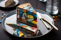 thin slices of delicious multi-colored dessert mosaic cake