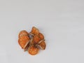 Thin slices of dried quince are placed on a white background.