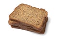 Thin slices of fresh baked brown flaxseed bread close up on white background