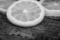 Thin slices of lemon on a wooden surface. Royalty Free Stock Photo