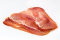 Thin slices of spanish serrano ham isolated on white background Royalty Free Stock Photo