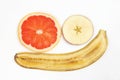 Thin slicing different fruits on white background
