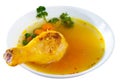 Thin soup with chicken leg in white bowl Royalty Free Stock Photo