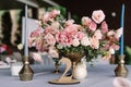 A thin Stylish blue candle in a stylish metal candlestick in wedding decor. Table number Royalty Free Stock Photo