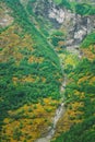 Thin water stream flowing from slope of Norwegian