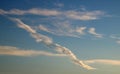 Thin wispy cirrus clouds seen against blue sky