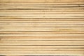 Thin wooden slats of light wood lie close to each other horizontally. View from above. Background and texture Royalty Free Stock Photo