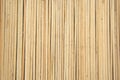 Thin wooden slats of light wood lie close to each other vertically. View from above. Background and textures Royalty Free Stock Photo