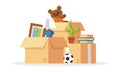 Things collected to pile ball, teddy bear, plant, books, picture, cardboard boxes for relocation, moving. Royalty Free Stock Photo