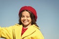 Things gonna be alright. Girl wink cheerful face blue sky background. Kid girl wear hat and coat cheerful satisfied with