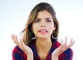 Things are just not going her way. Portrait of a young woman looking displeased against a white background. Royalty Free Stock Photo