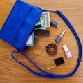 Things from open lady handbag. Royalty Free Stock Photo