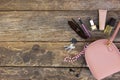 Things from open lady purse. Cosmetics and women`s accessories fell out of handbag Royalty Free Stock Photo