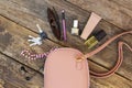 Things from open lady purse. Cosmetics and women`s accessories fell out of handbag Royalty Free Stock Photo