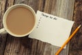 Things to do list, inscription. Blank papper and cup of coffee, over rustic wooden background, conceptual