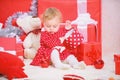 Things to do with toddlers at christmas. Gifts for child first christmas. Little baby girl play near pile of gift boxes Royalty Free Stock Photo