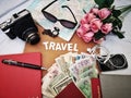 Things to pack for your travel with your camera, passport, note book and currency.