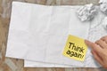 Think again words crumpled sticky note paper on texture paper as Royalty Free Stock Photo