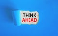 Think ahead symbol. Concept words Think ahead on beautiful white paper on a beautiful blue background. Business, support, Royalty Free Stock Photo