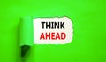 Think ahead symbol. Concept words Think ahead on beautiful white paper on a beautiful green background. Business, support, Royalty Free Stock Photo