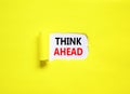 Think ahead symbol. Concept words Think ahead on beautiful white paper on a beautiful yellow background. Business, support, Royalty Free Stock Photo