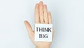 THINK BIG message on the card shown by a man Royalty Free Stock Photo