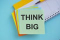Think big motivational concept. On a light blue background.Symbol of creativity, visions, ideas, inspiration and motivation