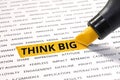 Think big word highlighted with marker on paper related word