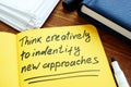 Think creatively to identify new approaches written on page