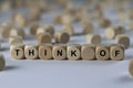 Think of - cube with letters, sign with wooden cubes