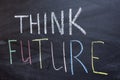 Think future inscription on a chalkboard. The concept of development and a positive Outlook for the future Royalty Free Stock Photo