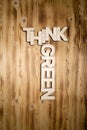 THINK GREEN words made of wooden letters on wooden board