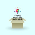 Think outside the box concept with colorful lightbulb