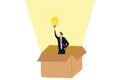 Think outside the box, smart businessman get out of paper box with new illumination lightbulb idea Royalty Free Stock Photo