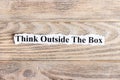 Think Outside The Box text on paper. Word Think Outside The Box on torn paper. Concept Image Royalty Free Stock Photo