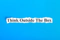 Think Outside The Box text on paper. Word Think Outside The Box on torn paper. Concept Image Royalty Free Stock Photo